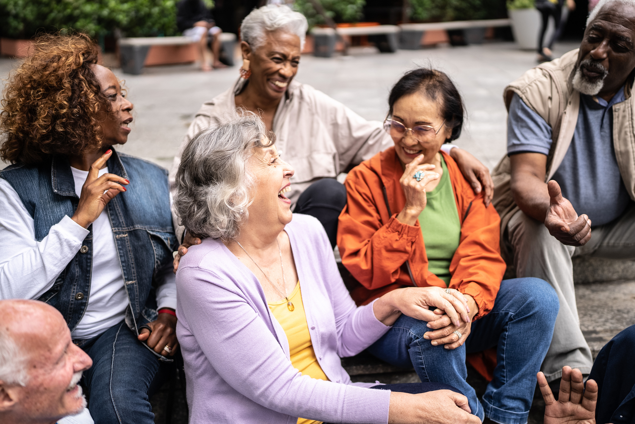Senior group sitting on steps