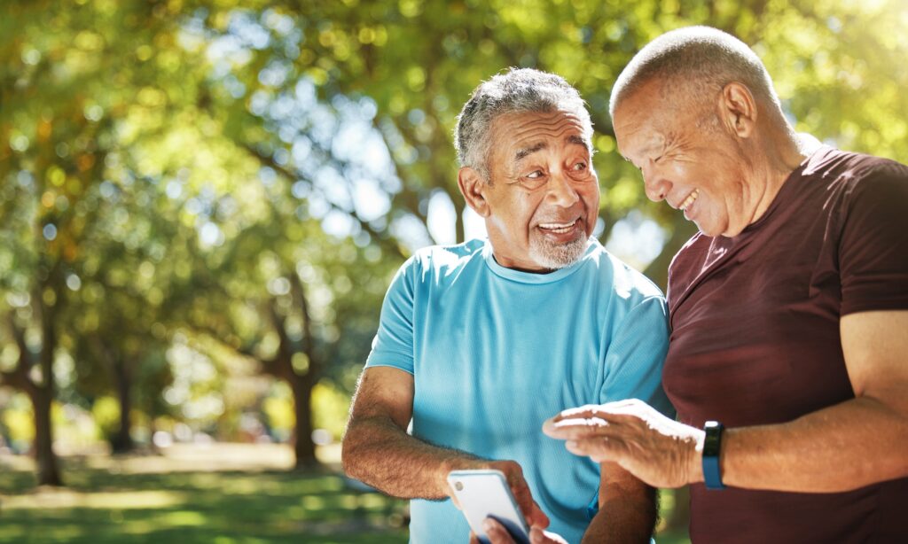senior friends walking in park